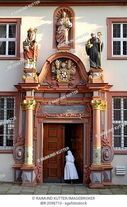 Renaissance portal with the figures of St. Boniface, Jesus Christ and St. Benedict of Nursia, convent building of the former Benedictine monastery at Fulda...