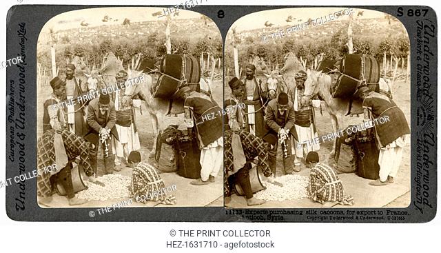Experts purchasing silk cocoons, for export to France, Antioch, Syria, 1900s. Stereoscopic slide