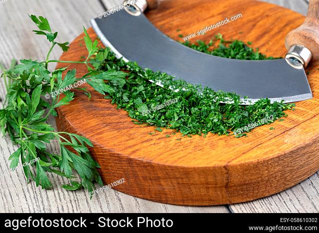 Parsley. On a chopping board in the kitchen