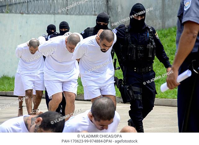 Mebers of the Salvadorian gang Mara Salvatrucha are guarded by security forces after their arrest at the high security prison in Zacatecoluca, El Salvador