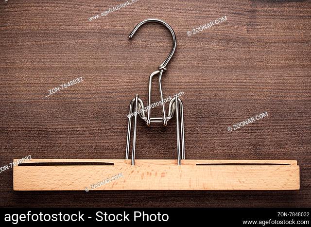 clothing hanger on the brown wooden table