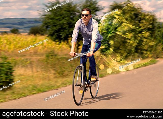 Gorgeous biker in the nature going somewhere with ethereal concept
