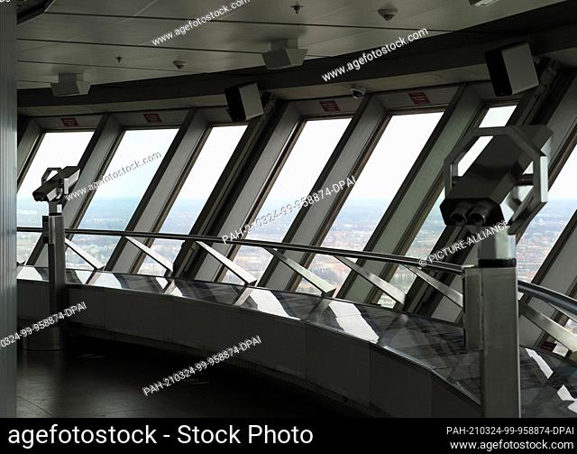 23 March 2021, Berlin: The viewing platform in the TV tower at Alexanderplatz, 203 metres above the ground. There are telescopes at the windows at regular...