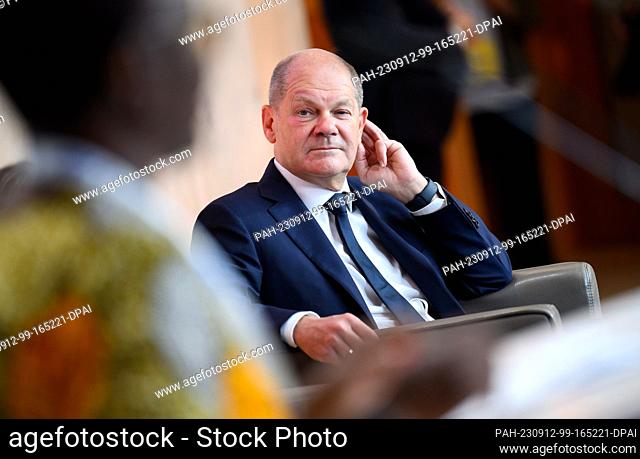 12 September 2023, Berlin: German Chancellor Olaf Scholz (SPD) is sitting at the International Meeting of the Christian Community of Sant'Egidio