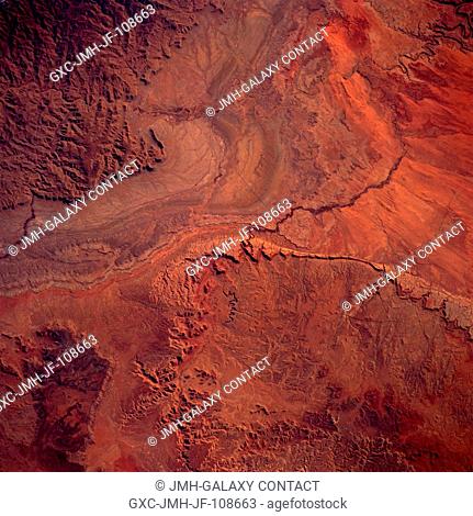 The rugged canyon region around the Green River in east-central Utah is featured in this east-looking, low-oblique photograph