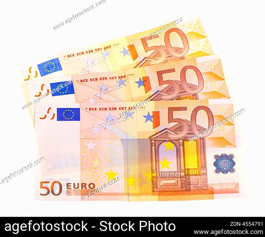 Some isolated 50 euro banknotes on a white background
