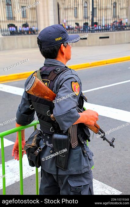 Policeman standing near Government Palace in Lima, Peru. Peruvian National Police is one of the largest police forces in South America