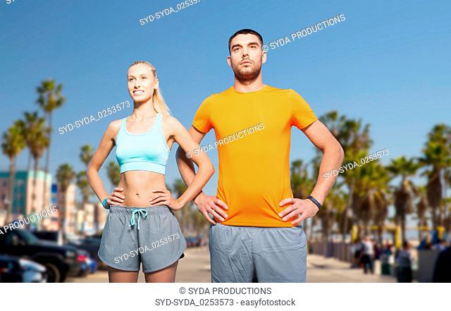 couple doing sports at summer over venice beach