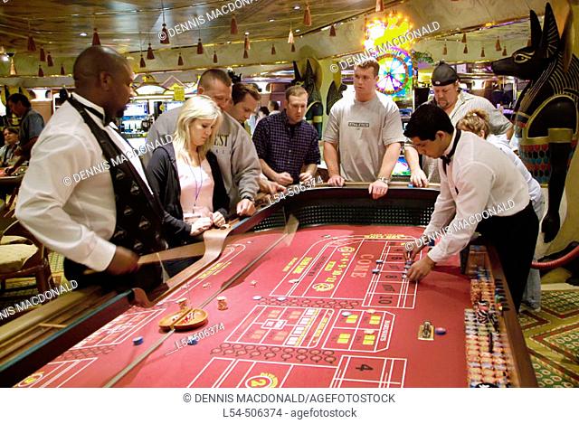 Gambling at the craps table aboard the Cruis Ship Carnival Fantasy traveling to the Islands of Nassau, St. Maarten, Martin, and St
