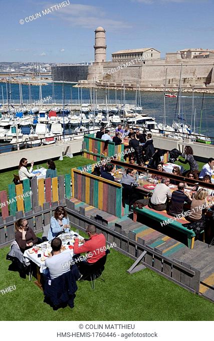 France, Bouches du Rhone, Marseille, Vieux Port, the Rowing Club colorée terrace with stunning views of the Old Port restaurant, Fort St