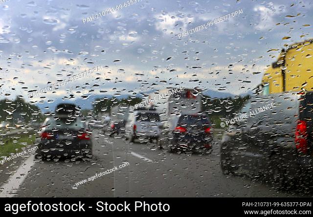 31 July 2021, Bavaria, Irschenberg: Cars pile up in the rain on the southbound Autobahn 8 (A8). Photo: Karl-Josef Hildenbrand/dpa