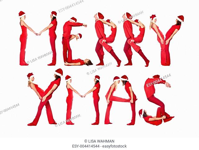 Group of red dressed people forming the phrase &039, MERRY XMAS&039