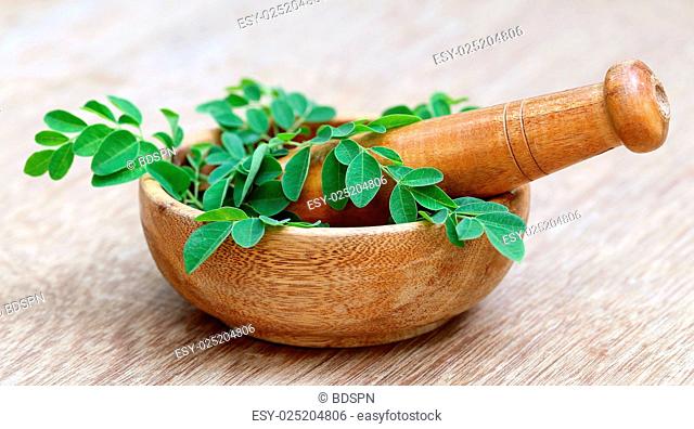 Moringa leaves and mortar pestle