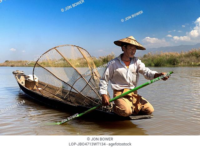 Myanmar, Shan, Lake Inle. Fisherman with unusual conical nets on Lake Inle in Myanmar