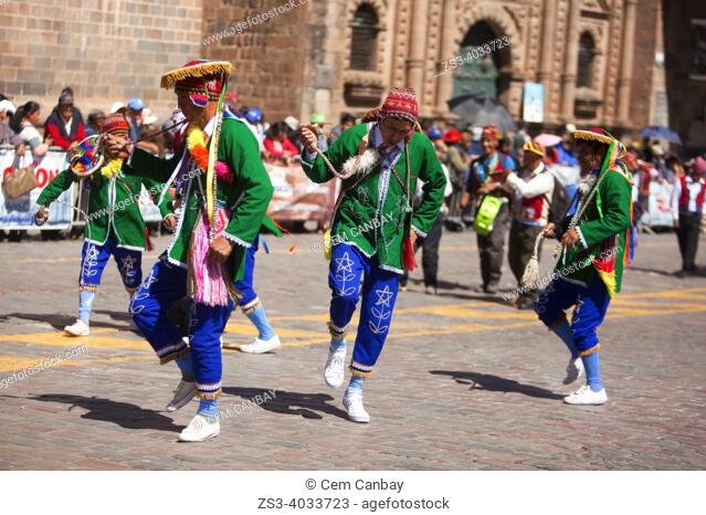 Indigenous people in traditional clothing during a performance at the Inti Raymi Festival near Plaza de Armas at the historic center Cusco, Peru, South America