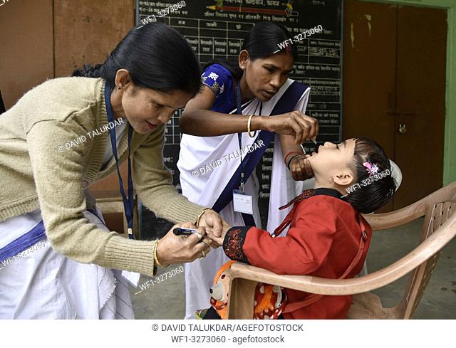 Guwahati, Assam, India. March 10, 2019. An Indian child receives polio vaccine drops on National Immunisation Day in Guwahati
