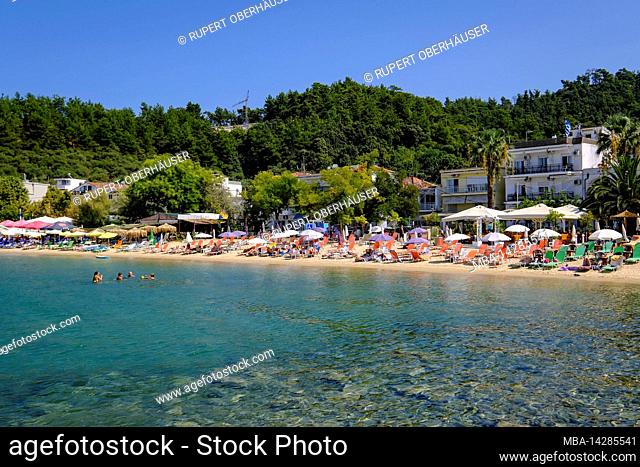 Bathing beach at fishing port, capital Limenas, Thassos, Greece