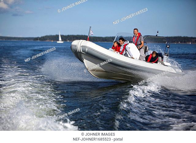 Family in motorboat
