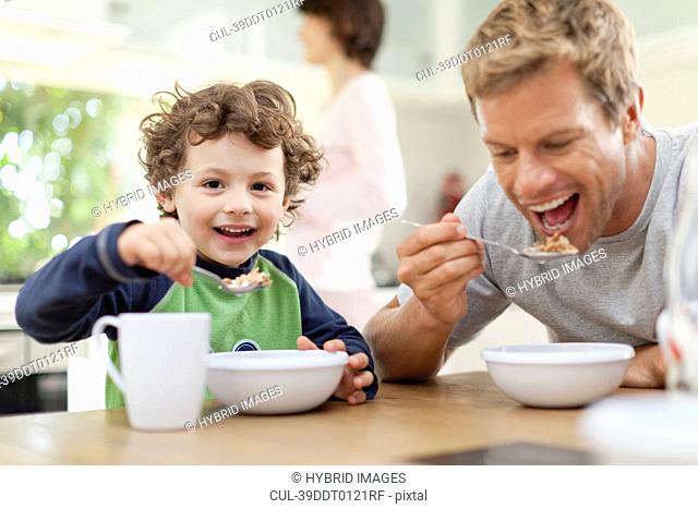 Father and son eating breakfast