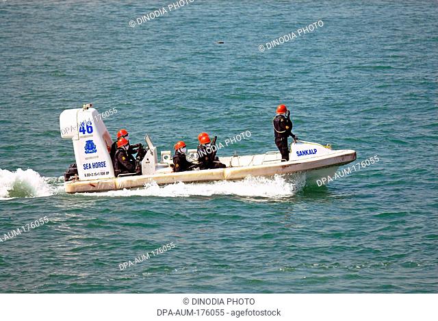 Commandos in speed boat rescue operation , Bombay , Maharashtra , India