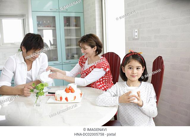 Daughter and parents having tea