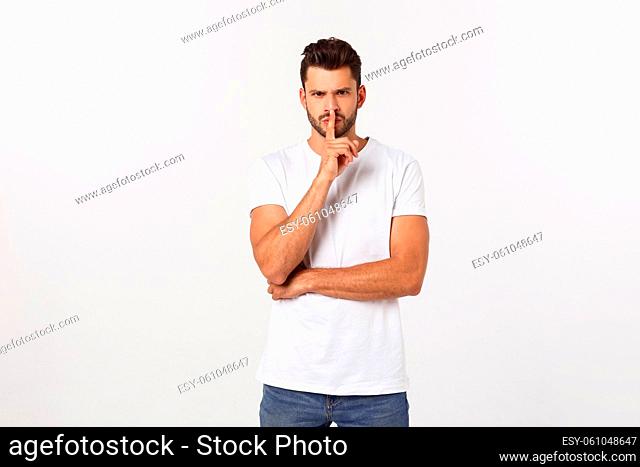Close up portrait of disappointed stressed bearded young man in shirt over white background