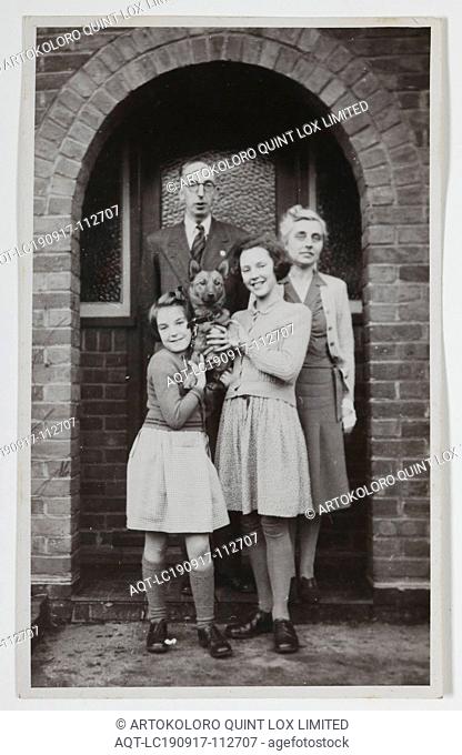 Photograph - Palmer Family Outside House, Iver, England, circa 1947, Black and white photograph of George and Gertrude Palmer and their daughters Shirley and...