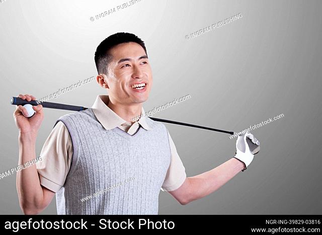 Portrait of young golf player