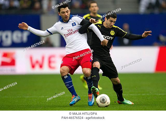 Hamburg's Tolgay Arslan (L) in action against Dortmund's Henrikh Mkhitaryan during the German Bundesliga soccer match between Hamburger SV and Borussia Dortmund...