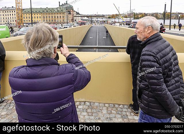 Stockholm, Sweden A senior couple on the new Slussbron, or Golden Bridge at Slussen, inaugurated Oct 25, 2020