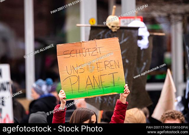 17 January 2020, Rhineland-Palatinate, Mainz: A demo participant holds up a poster on Gutenbergplatz saying ""protect our planet""