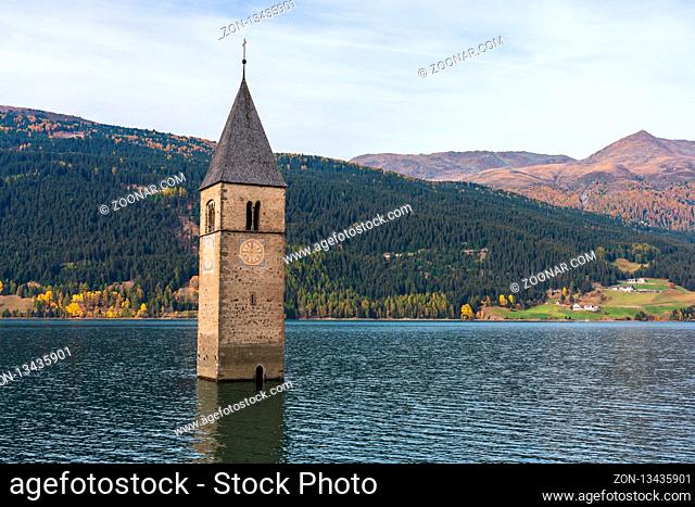 The famous bell tower in the Lake of Reschen - Lago di Resia in South Tyrol, Italy. During WW2 a dam was build and put the village under water