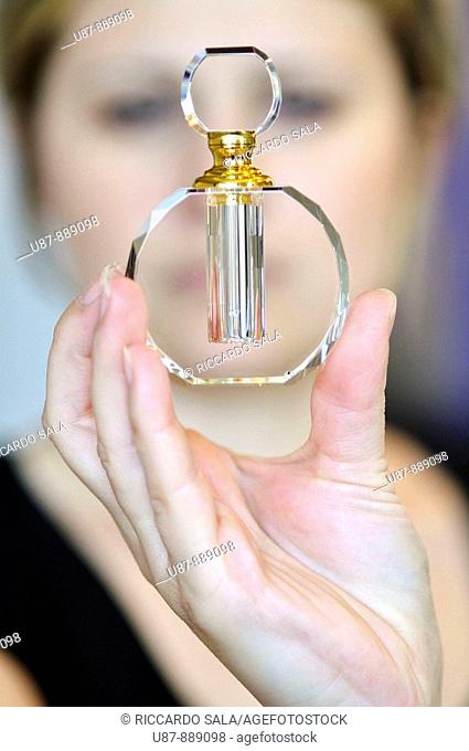 Woman Holding a Perfume Bottle