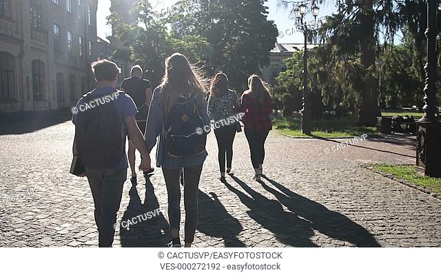 Group of college students walking outdoors
