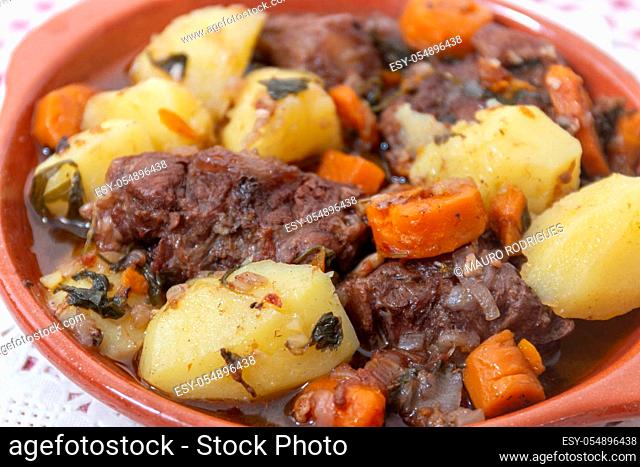 Traditional rustic meal of ox tail with potato and carrot of the Alentejo region, Portugal