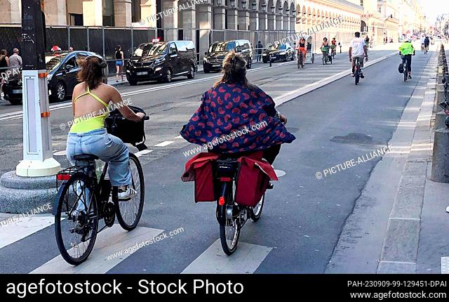 08 September 2023, France, Paris: Cyclists are on a road with separate lanes for each direction. In the first three months of the year