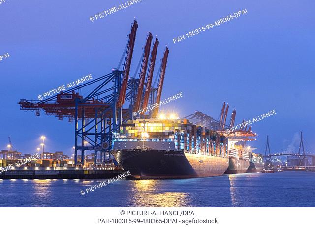 15 March 2018, Germany, Hamburg: The container ship ""Antoine de Saint Exupery"" of the ""CMA CGM"" shipping line lying at anchor in the Burchard-Kai Container...
