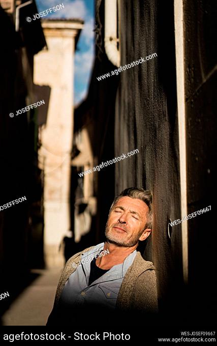 Mature man with sunlight on face