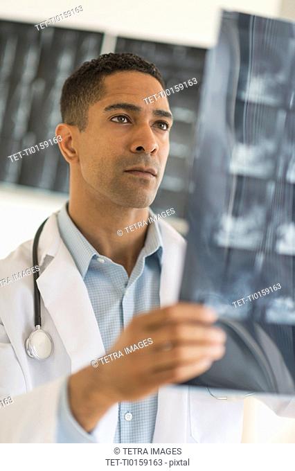 Male doctor reading MRI scan