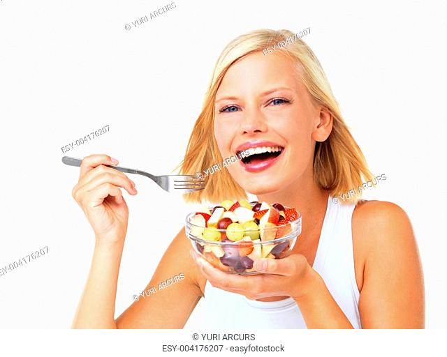 Portrait of a beautiful woman smiling and ready to eat her fruit salad