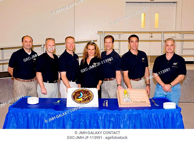 The STS-127 crew members celebrate the end of formal crew training with a cake-cutting ceremony in the Jake Garn Simulation and Training Facility at NASA's...
