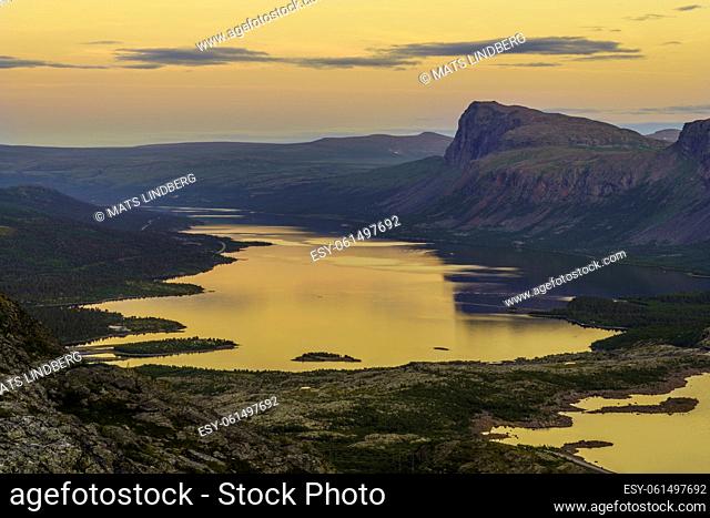 View over Stora sjöfallet nationalpark in the evening with nice warm evening light, mountains in background, Stora sjöfallet nationalpark, Swedish Lapland