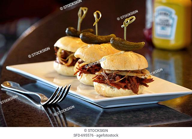 Barbecue Pulled Pork Sliders with Skewered Pickles, On Diner Table