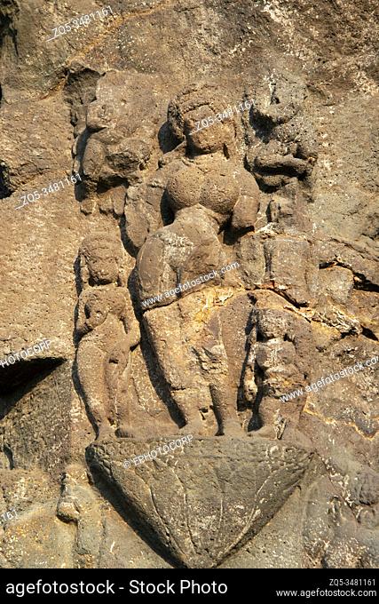 Ellora Caves, Aurangabad, Maharashtra, India Cave No. 18, Female figure with attendants on the pillar. The figure is in a bad state of preservation due to flaw...
