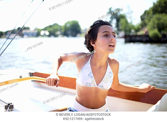 Girl steering a sailboat