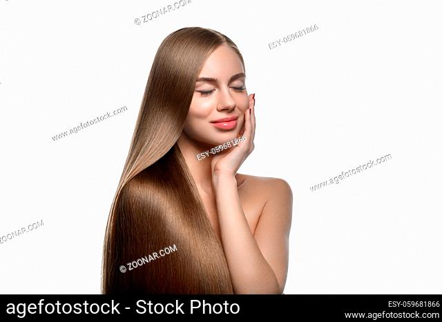 beautiful young woman with long healthy shiny hair. copy space. isolated on white background