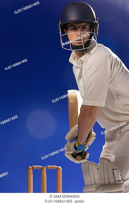 Cricket player holding bat