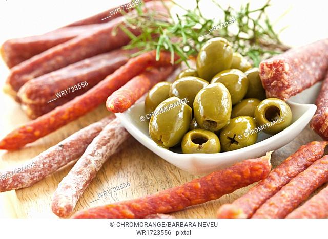 Sausages and green olives