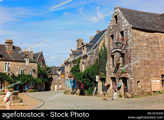 Houses in the medieval village of Locronan, fountain in the market square, one of the Plus beaux villages de France Most beautiful villages in France, Brittany
