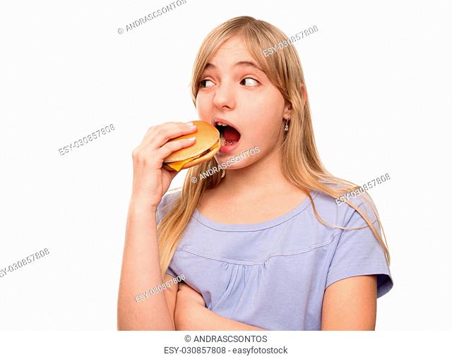 Girl eating a hamburger isolated on white